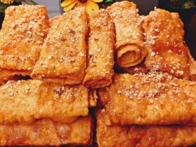 Greek Diples Honey Rolls on a plate - Χριστουγεννιάτικες Δίπλες