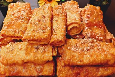 Greek Diples Honey Rolls on a plate - Χριστουγεννιάτικες Δίπλες